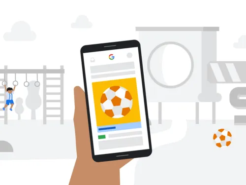 Illustratieve hand met telefoon waarop een Google advertentie te zien is